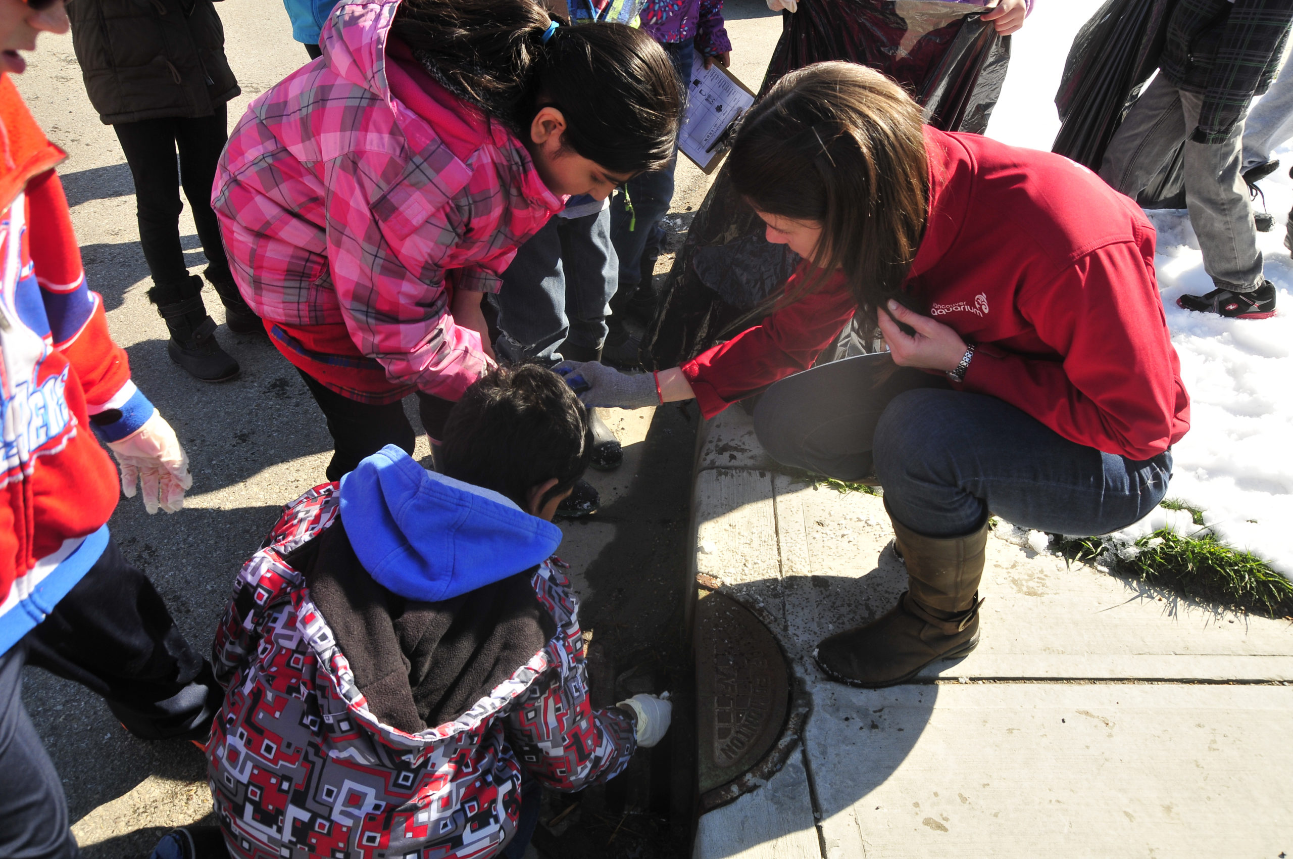 The Aquarium's Great Canadian Shoreline Cleanup team assisting with storm drain cleanup.